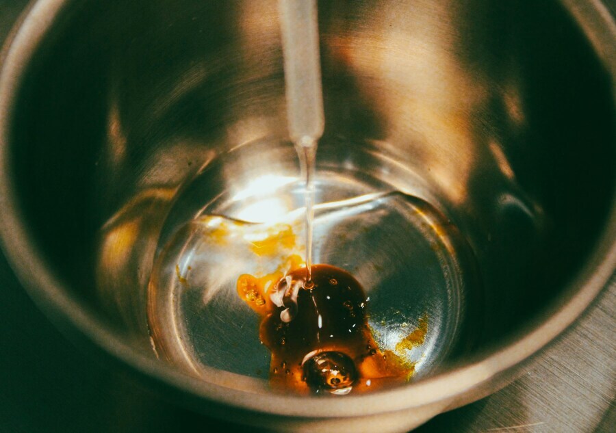 Adding cannabis distillate to gelatin mixture when making gummies with distillate Adding cannabis distillate to gelatin mixture when making gummies with distillate